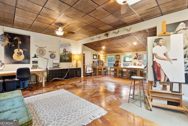 tiled living area with ceiling fan