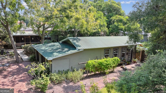 exterior space featuring metal roof