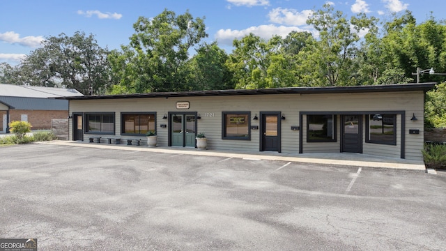 view of property with uncovered parking