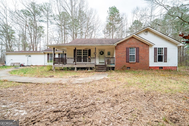 view of front of home with crawl space and a porch