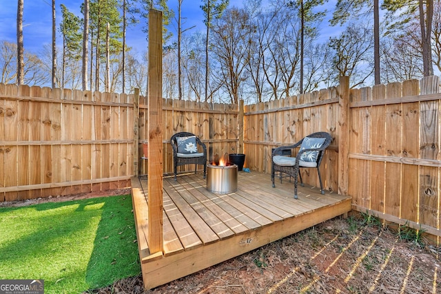 deck with fence and a lawn