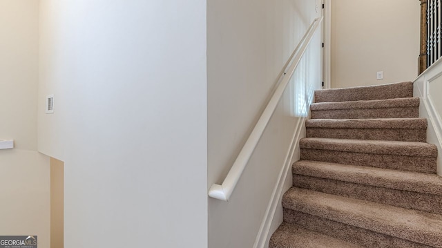 staircase with visible vents