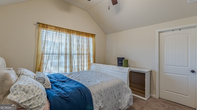 carpeted bedroom with a ceiling fan, lofted ceiling, and visible vents