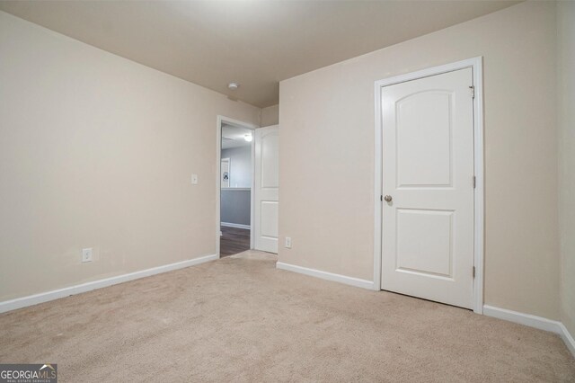 5987 Westchase St, Atlanta, GA 30336 - unfurnished bedroom with carpet floors and baseboards