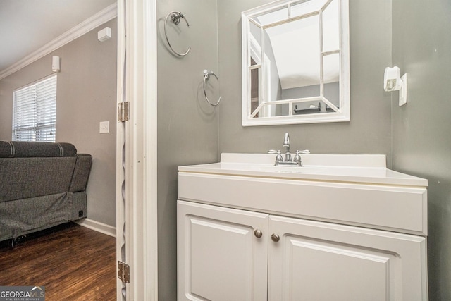 5987 Westchase St, Atlanta, GA 30336 - bathroom featuring crown molding, baseboards, wood finished floors, and vanity