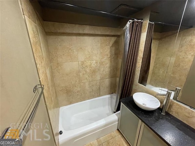 full bath featuring shower / bath combo and vanity