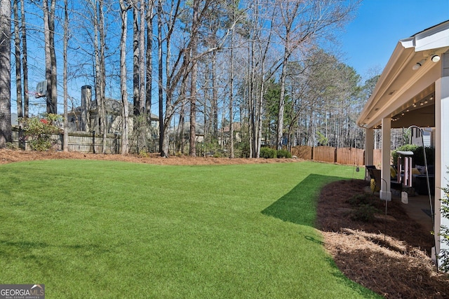 view of yard featuring fence