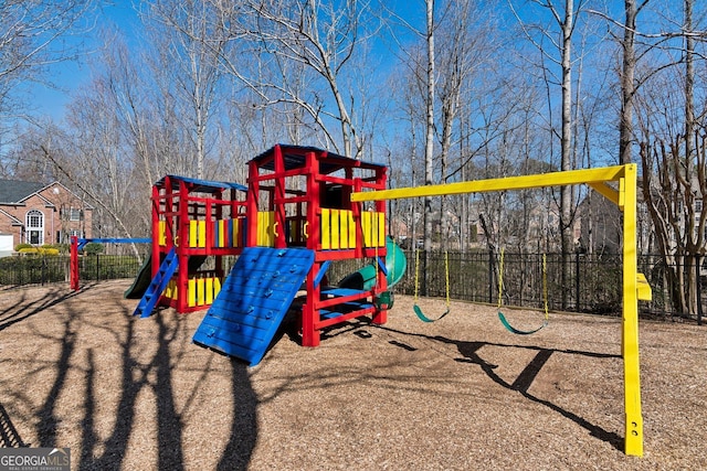 community jungle gym featuring fence