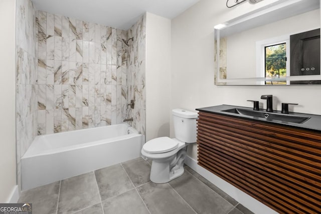 bathroom with bathing tub / shower combination, toilet, vanity, baseboards, and tile patterned floors