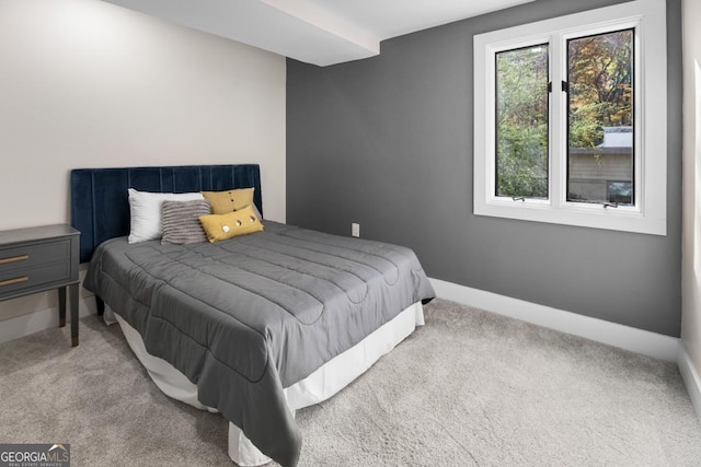 carpeted bedroom with baseboards