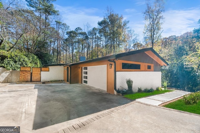 garage with concrete driveway