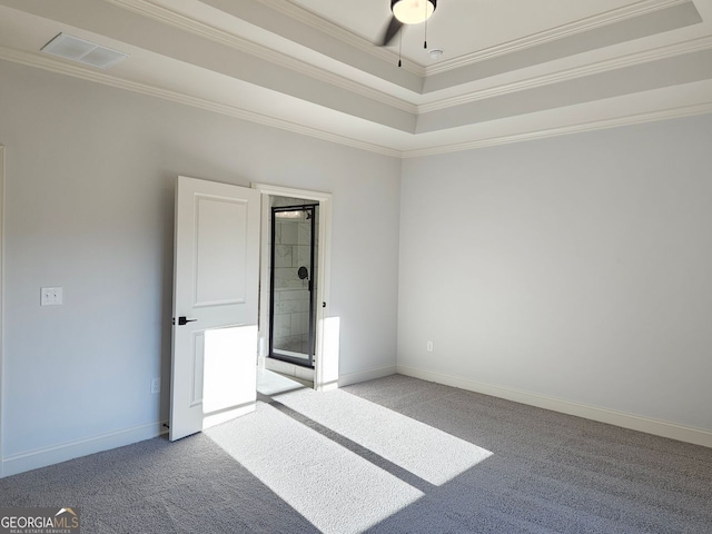 unfurnished room featuring ornamental molding, carpet flooring, visible vents, and baseboards