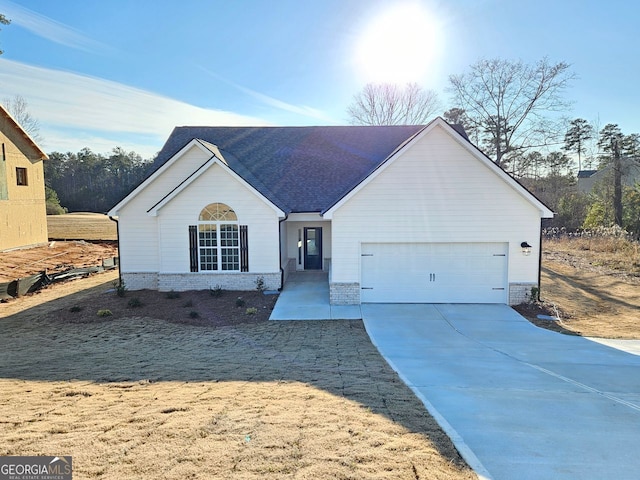 single story home featuring a garage, brick siding, driveway, and a shingled roof