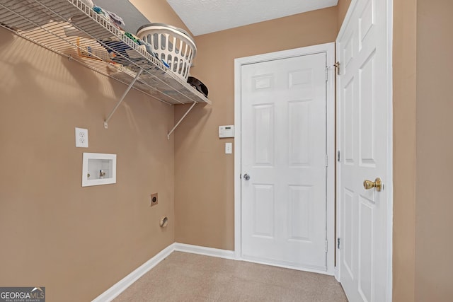 washroom featuring laundry area, baseboards, hookup for a washing machine, a textured ceiling, and hookup for an electric dryer