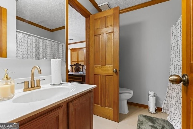 full bathroom featuring a textured ceiling, toilet, vanity, ornamental molding, and tile patterned floors