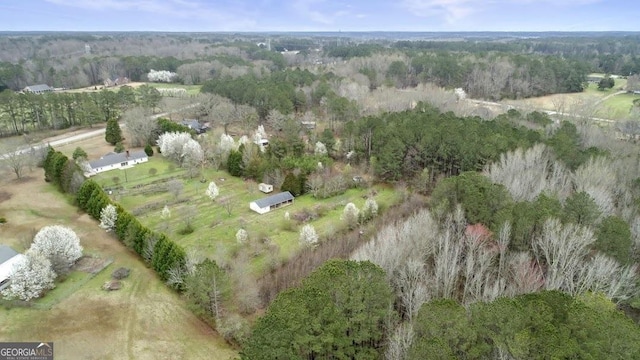 bird's eye view with a rural view and a view of trees