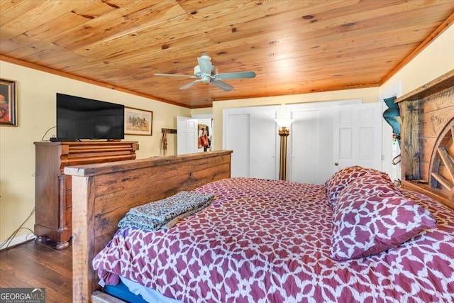 bedroom with ornamental molding, wood ceiling, and wood finished floors