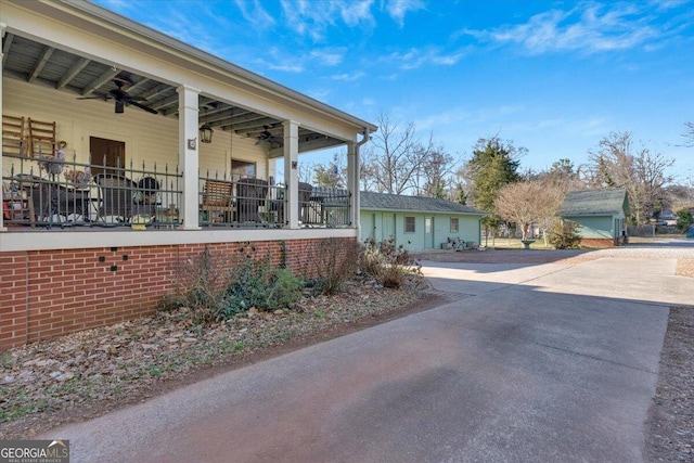 view of side of home featuring ceiling fan