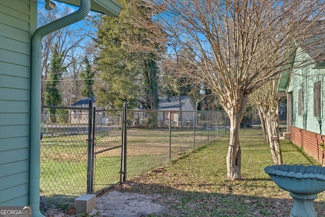 view of yard with a gate and fence