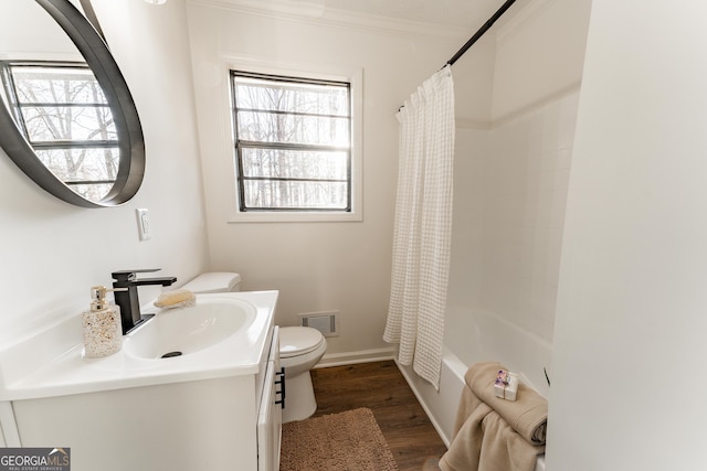 full bath with toilet, wood finished floors, visible vents, vanity, and ornamental molding