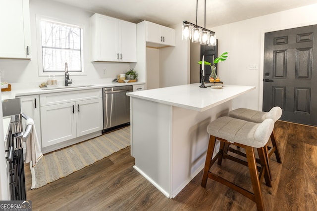 kitchen with dark wood-style floors, a center island, stainless steel appliances, white cabinetry, and a sink