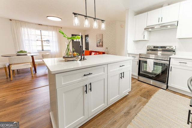 kitchen featuring white cabinets, light wood-style flooring, stainless steel electric stove, light countertops, and under cabinet range hood