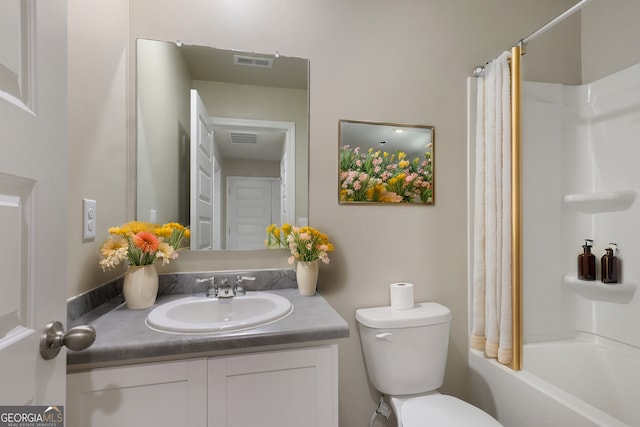 bathroom with shower / bath combo, visible vents, vanity, and toilet