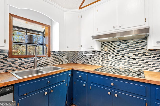 kitchen with black electric cooktop, under cabinet range hood, white cabinets, blue cabinetry, and dishwasher