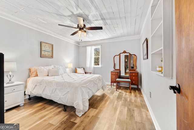 bedroom featuring wood ceiling, ornamental molding, light wood-style flooring, and baseboards