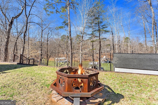 view of yard with an outdoor fire pit