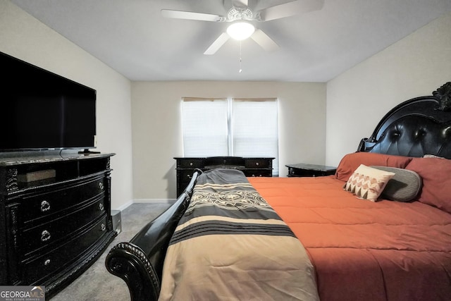 carpeted bedroom featuring ceiling fan and baseboards