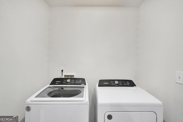 washroom with laundry area and washing machine and clothes dryer