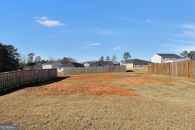 view of yard with fence