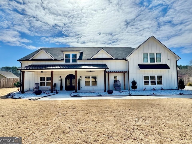 view of front of home featuring a ceiling fan, metal roof, a standing seam roof, covered porch, and board and batten siding