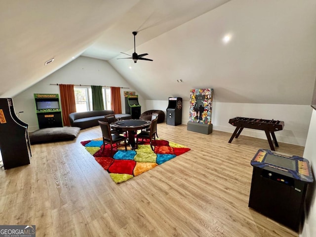 game room featuring a ceiling fan, vaulted ceiling, and wood finished floors