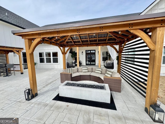 view of patio / terrace with an outdoor living space with a fire pit and a gazebo