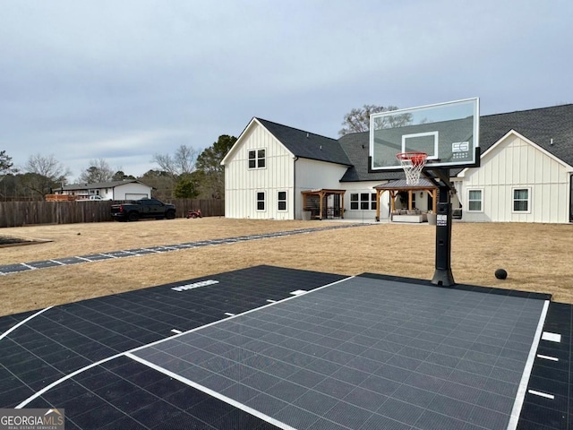 view of basketball court with fence and basketball court