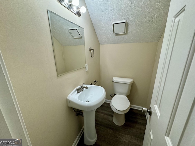 6380 Phillips Pl, Lithonia, GA 30058 - bathroom featuring wood finished floors and a textured ceiling