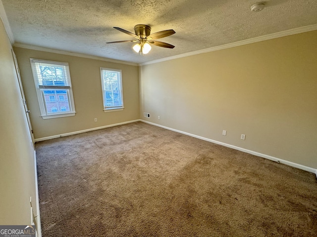 carpeted empty room with baseboards, a ceiling fan, and crown molding