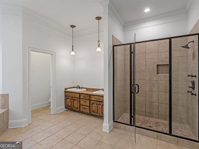 full bath featuring ornamental molding, a stall shower, a sink, and toilet