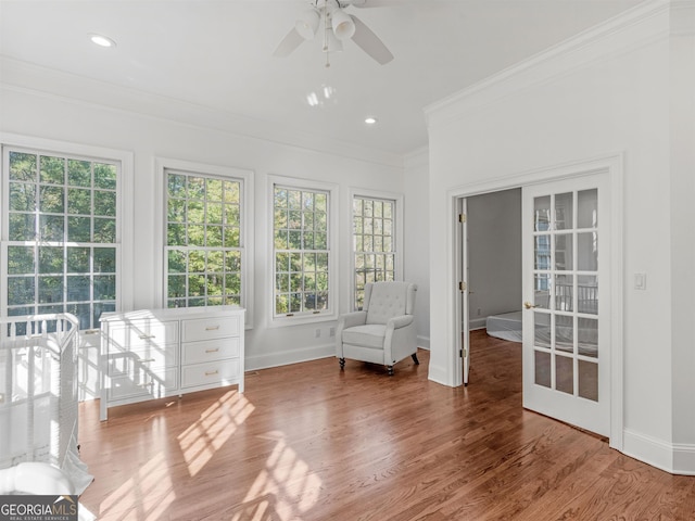 unfurnished room featuring crown molding, recessed lighting, a ceiling fan, wood finished floors, and baseboards