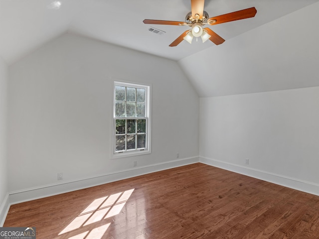 bonus room with visible vents, a ceiling fan, vaulted ceiling, wood finished floors, and baseboards