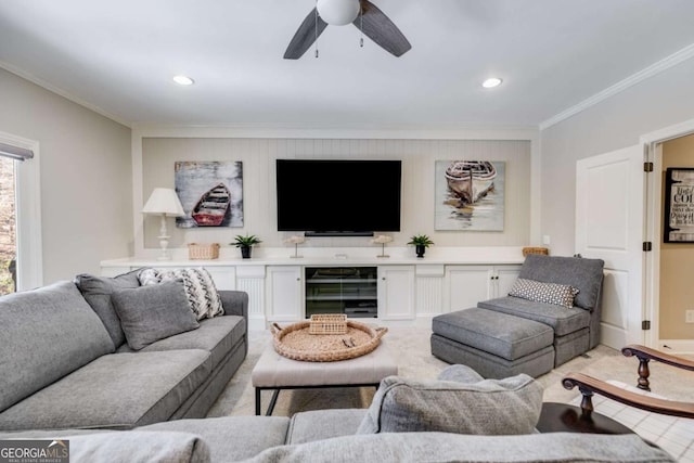 living area with recessed lighting, a ceiling fan, and crown molding