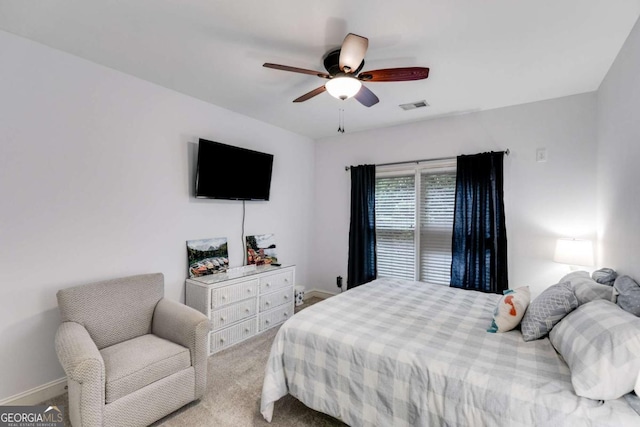 bedroom featuring a ceiling fan, carpet, visible vents, and baseboards