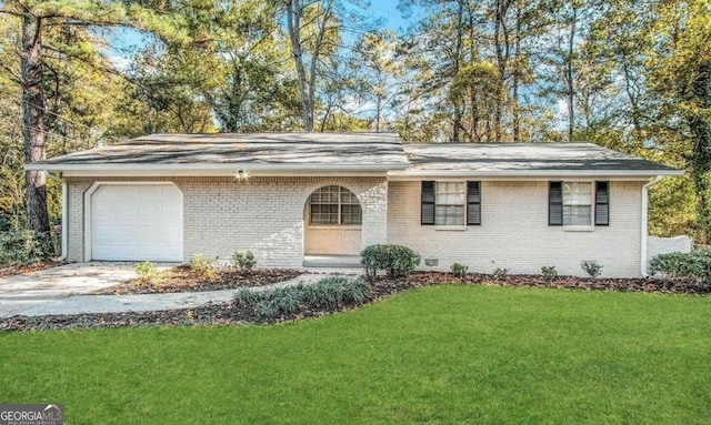 ranch-style home featuring brick siding, crawl space, an attached garage, and a front yard