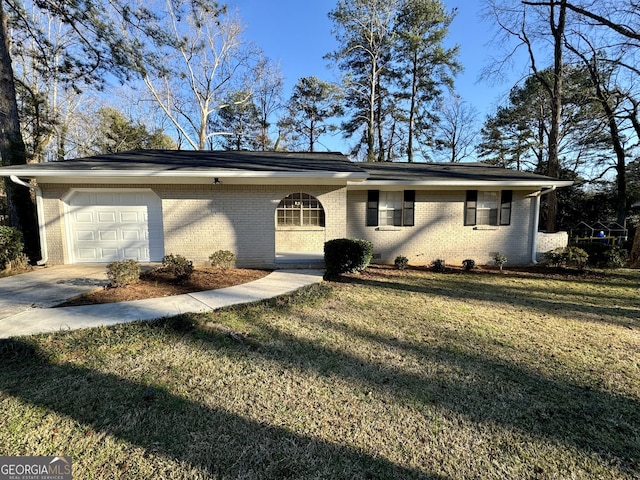 single story home featuring a garage, driveway, a front lawn, and brick siding