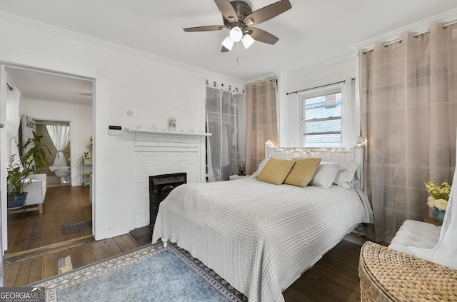 bedroom with a ceiling fan, a fireplace, crown molding, and hardwood / wood-style floors