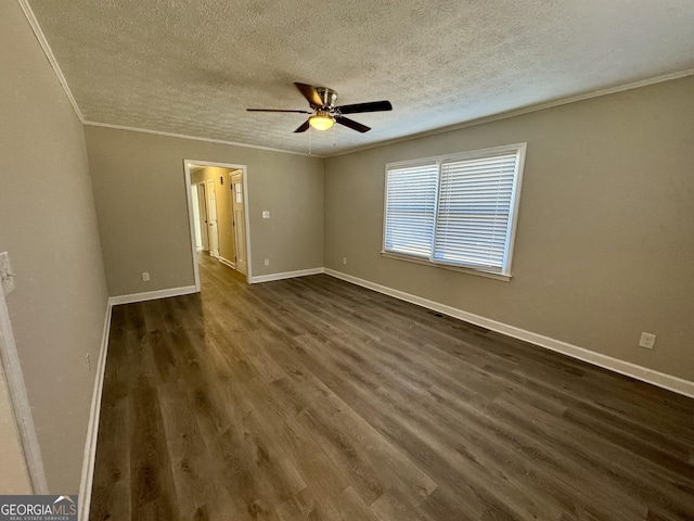 unfurnished bedroom with ornamental molding, dark wood-type flooring, a textured ceiling, and baseboards