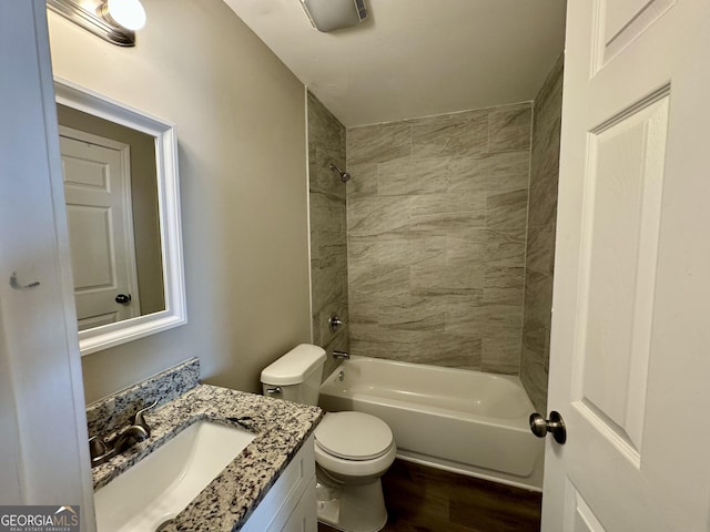 full bath featuring shower / washtub combination, vanity, toilet, and wood finished floors