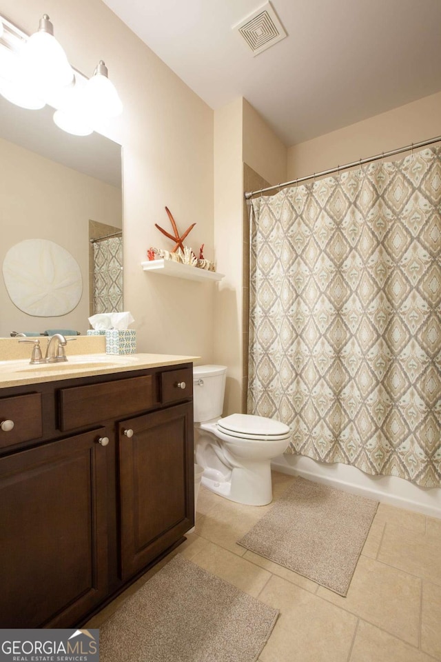 bathroom featuring tile patterned flooring, toilet, shower / tub combo, vanity, and visible vents